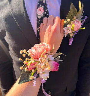 Assorted prom flowers including corsages and boutonnieres to complement your outfit